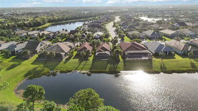 a view of a swimming pool with sitting area