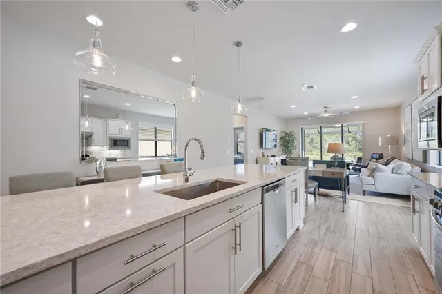 a view of a patio with table and chairs under an umbrella