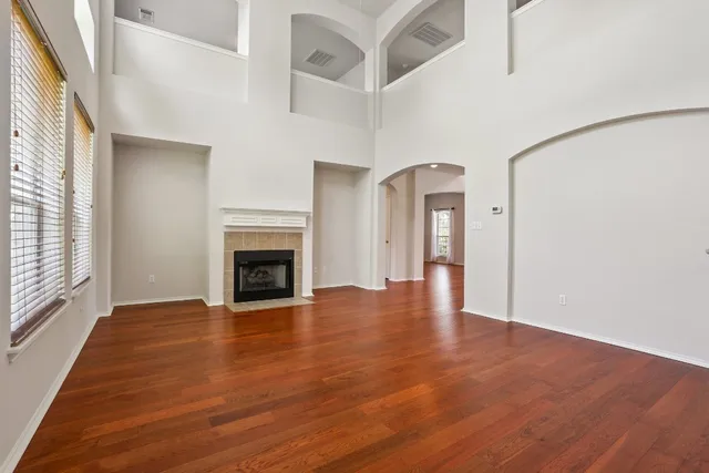 a view of an entryway with wooden floor and a window