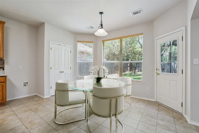 a dining room with furniture and window