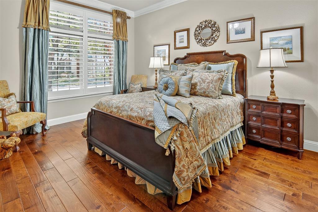 825 Milton Way Coppell, TX 75019 - Photo 14 of 35 a bedroom with a bed a dresser and chair