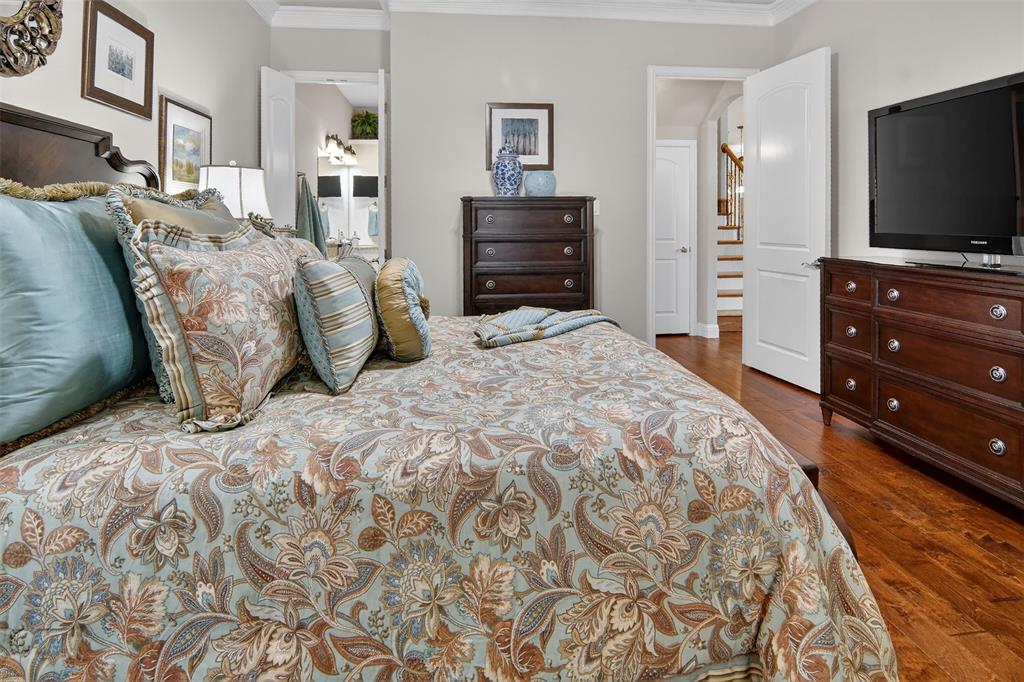 825 Milton Way Coppell, TX 75019 - Photo 16 of 35 a bedroom with a bed and a flat screen tv