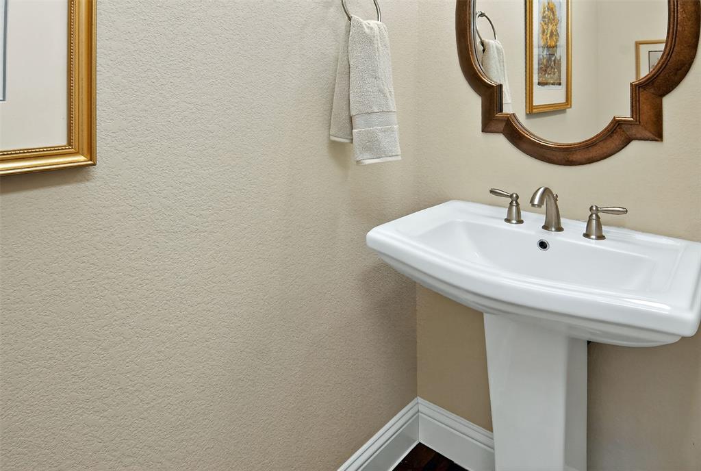 825 Milton Way Coppell, TX 75019 - Photo 19 of 35 a bathroom with a sink and a mirror