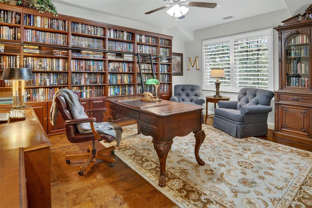 825 Milton Way Coppell, TX 75019 - Photo 23 of 35 a view of a livingroom with furniture and a bookshelf