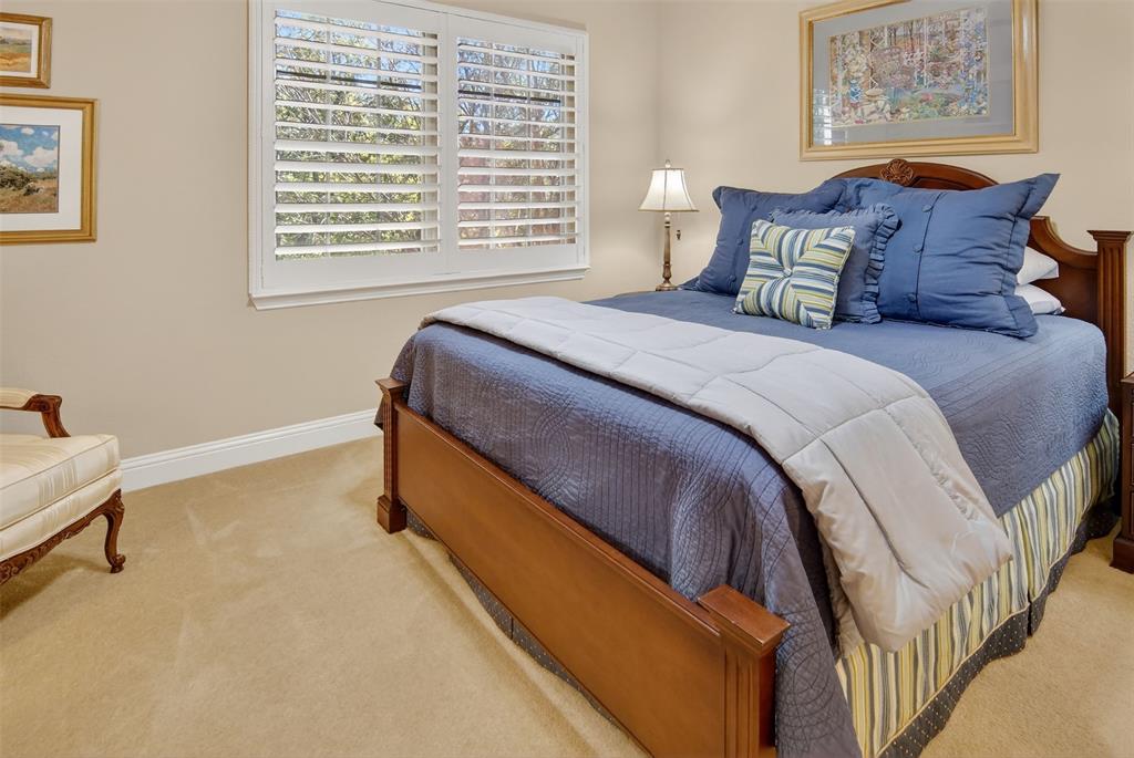825 Milton Way Coppell, TX 75019 - Photo 24 of 35 a bedroom with a bed and a window