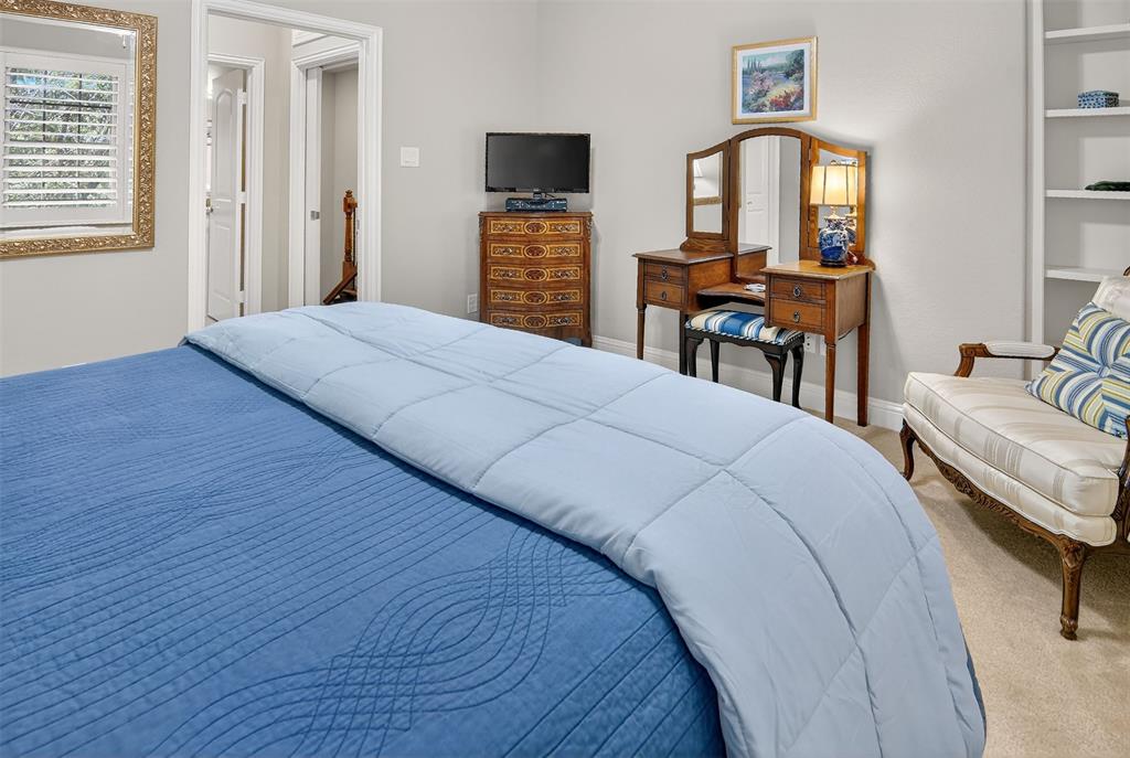 825 Milton Way Coppell, TX 75019 - Photo 25 of 35 a bedroom with a bed and a flat screen tv