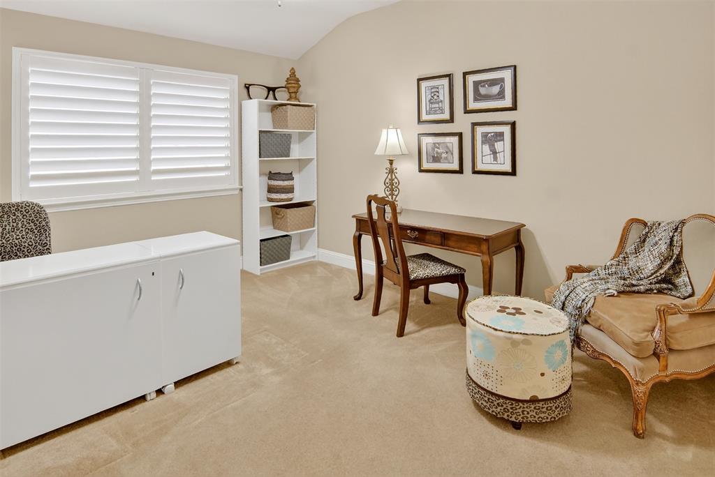 825 Milton Way Coppell, TX 75019 - Photo 27 of 35 a room with a chair and white walls