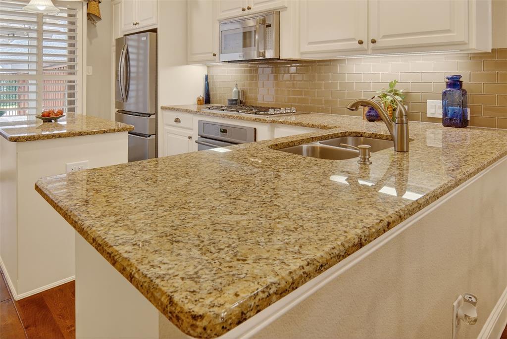 825 Milton Way Coppell, TX 75019 - Photo 10 of 35 a kitchen with stainless steel appliances granite countertop a sink stove and refrigerator