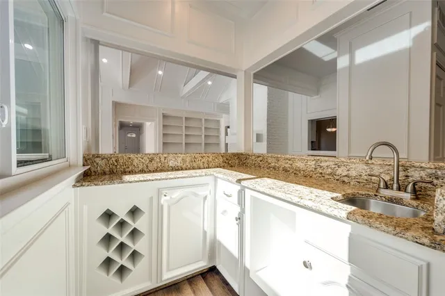 a kitchen with cabinets and sink