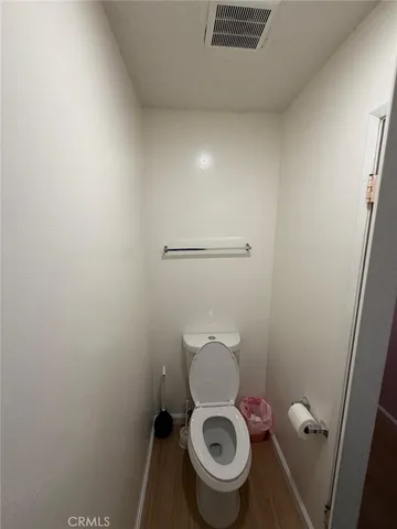 a white toilet sitting in a bathroom