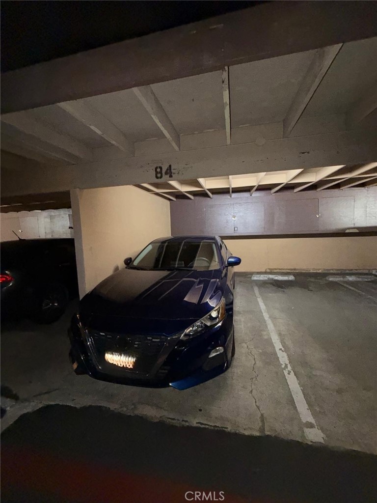 1602 North King Street, Unit S4 Santa Ana, CA 92706 - Photo 21 of 22 a car parked in a garage