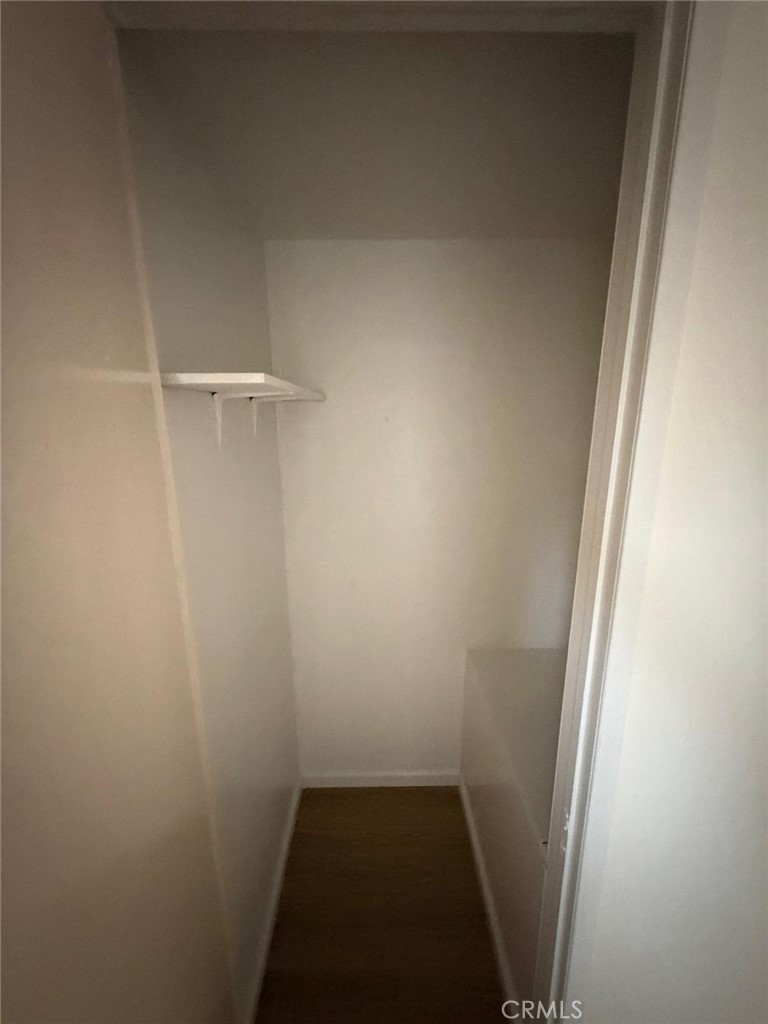 1602 North King Street, Unit S4 Santa Ana, CA 92706 - Photo 8 of 22 a view of small space with racks on the wall