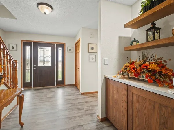 a bathroom with a toilet a sink and a mirror