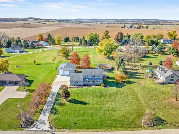 an aerial view of a house with a ocean view