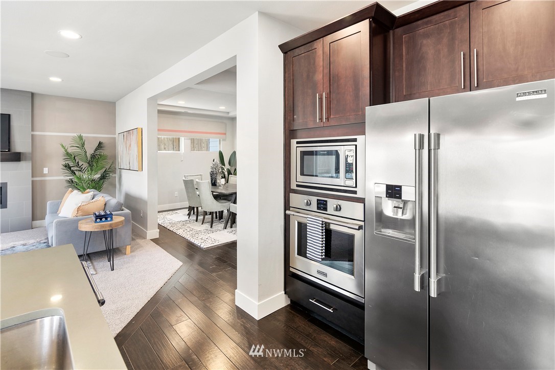 207 176th Place Southwest Bothell, WA 98012 - Photo 13 of 36 a kitchen with stainless steel appliances a refrigerator and a stove