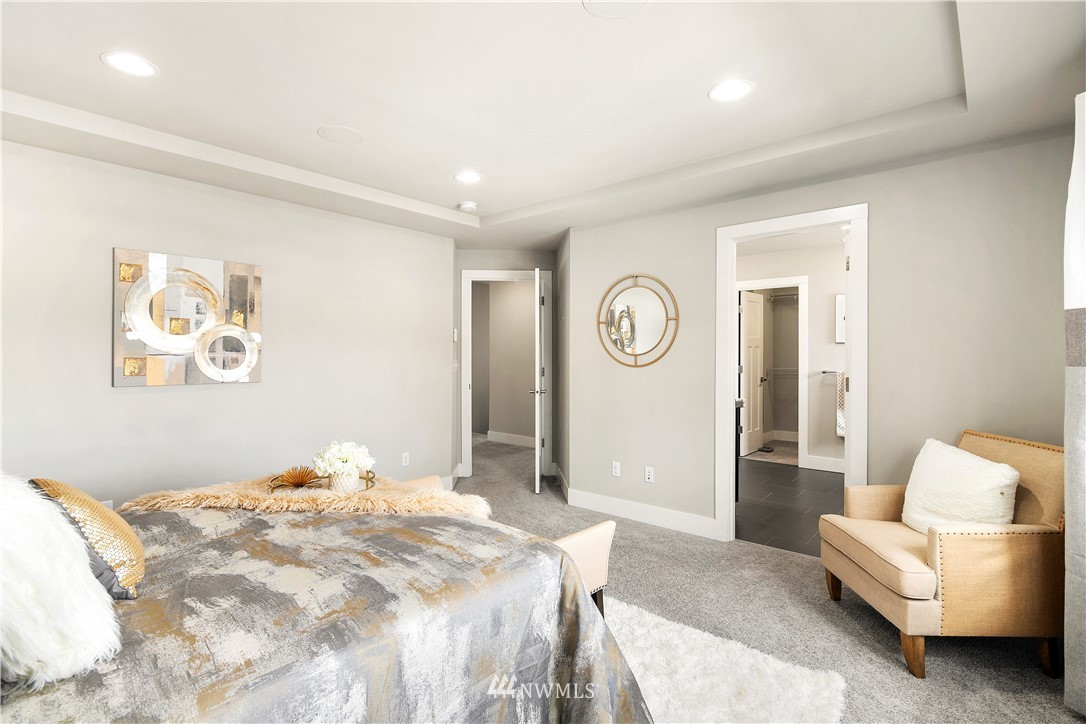 207 176th Place Southwest Bothell, WA 98012 - Photo 15 of 36 a bedroom with a bed and a couch