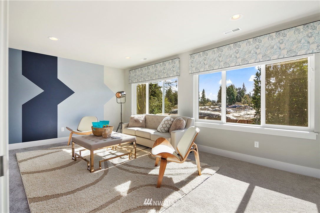 207 176th Place Southwest Bothell, WA 98012 - Photo 27 of 36 a living room with furniture and large windows