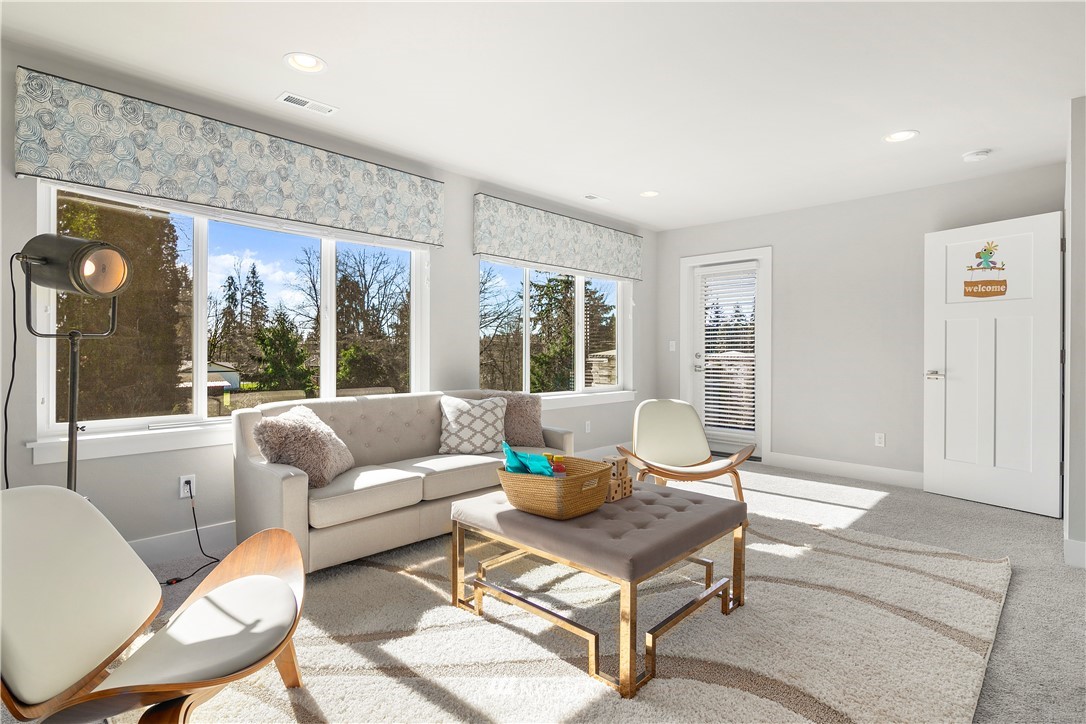 207 176th Place Southwest Bothell, WA 98012 - Photo 28 of 36 a living room with furniture and large windows