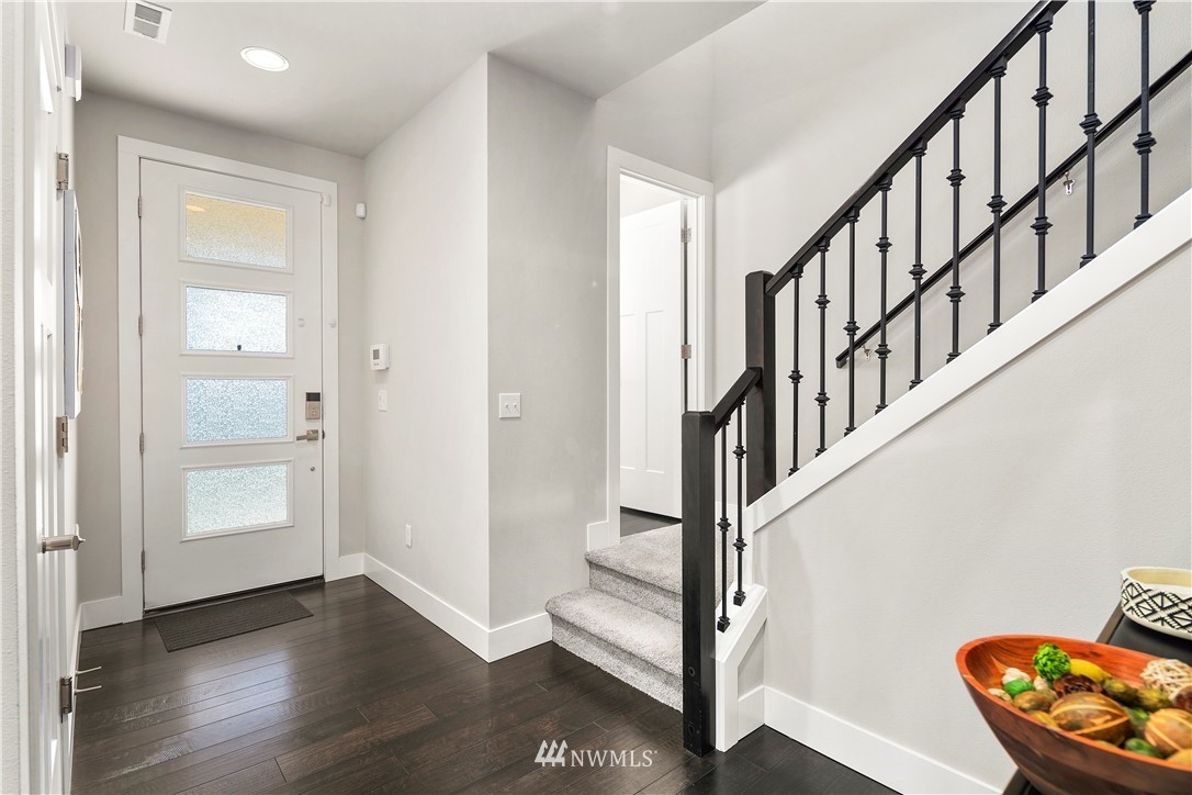 207 176th Place Southwest Bothell, WA 98012 - Photo 3 of 36 a view of an entryway with wooden floor