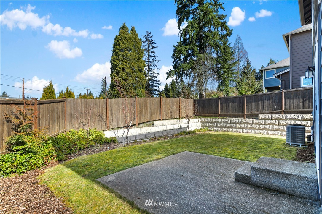 207 176th Place Southwest Bothell, WA 98012 - Photo 32 of 36 a view of a backyard with a garden and deck