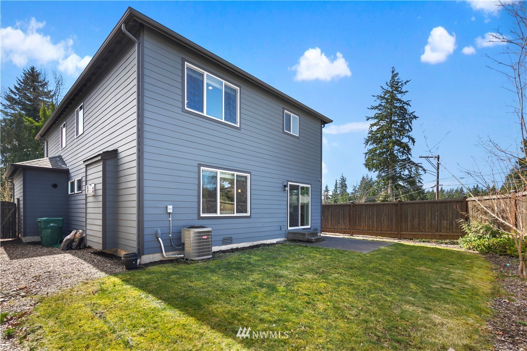 207 176th Place Southwest Bothell, WA 98012 - Photo 33 of 36 a backyard of a house with wooden floor and fence