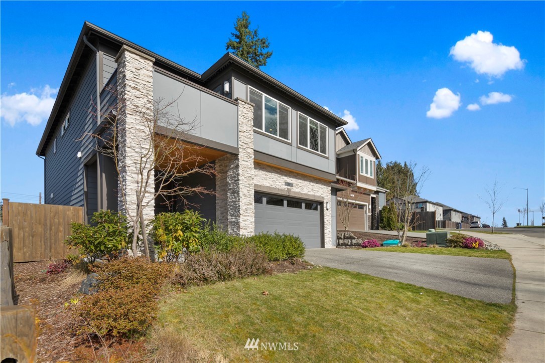 207 176th Place Southwest Bothell, WA 98012 - Photo 34 of 36 a multi story building with trees in front of it