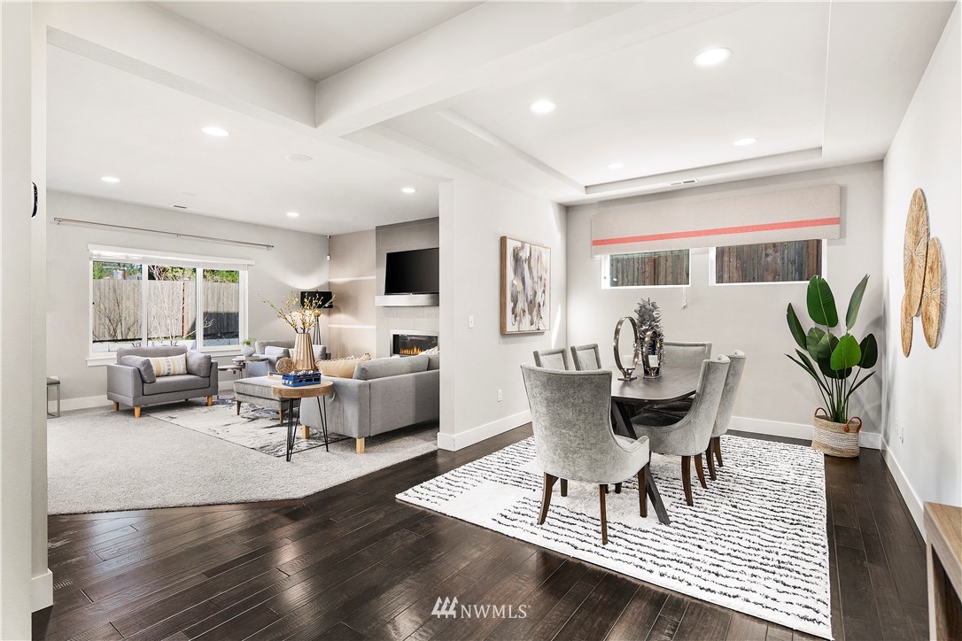 207 176th Place Southwest Bothell, WA 98012 - Photo 4 of 36 a living room with furniture a dining table and a potted plant