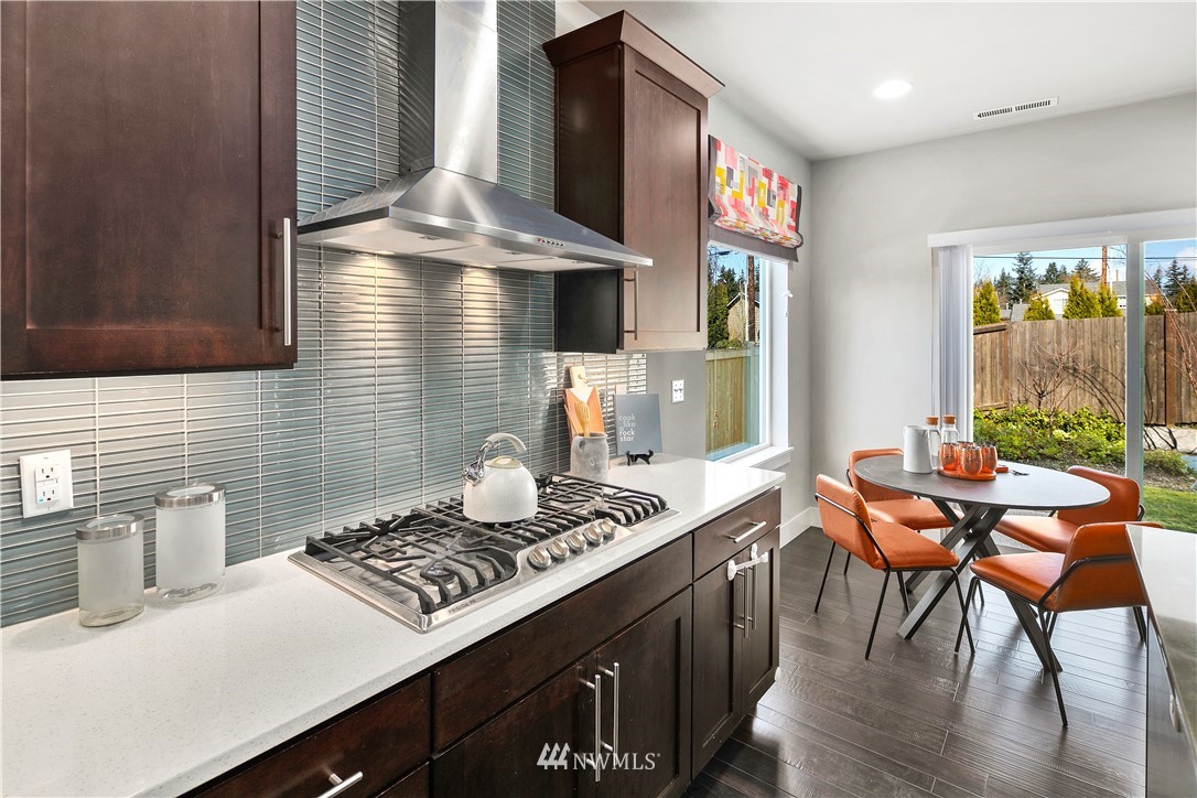 207 176th Place Southwest Bothell, WA 98012 - Photo 9 of 36 a kitchen with a stove and a table