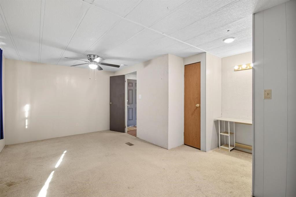 413 Charnel Street Clyde, TX 79510 - Photo 16 of 31 an empty room with chandelier fan
