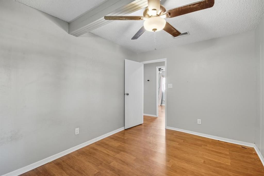413 Charnel Street Clyde, TX 79510 - Photo 24 of 31 a view of an empty room with wooden floor