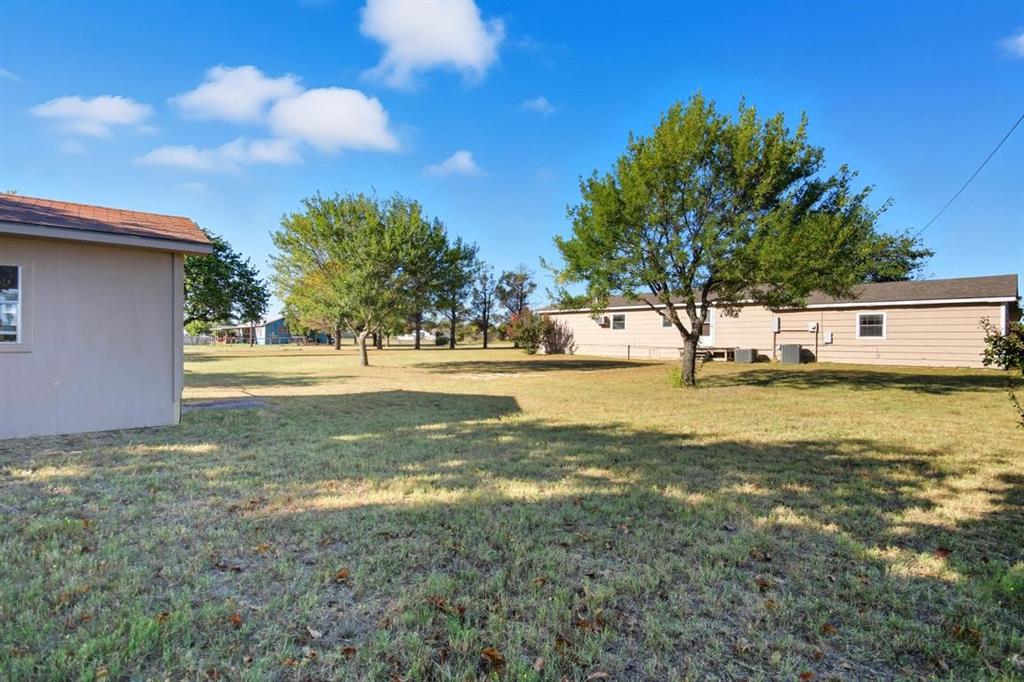 413 Charnel Street Clyde, TX 79510 - Photo 29 of 31 a view of a house with a yard