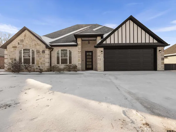 a front view of a house with yard