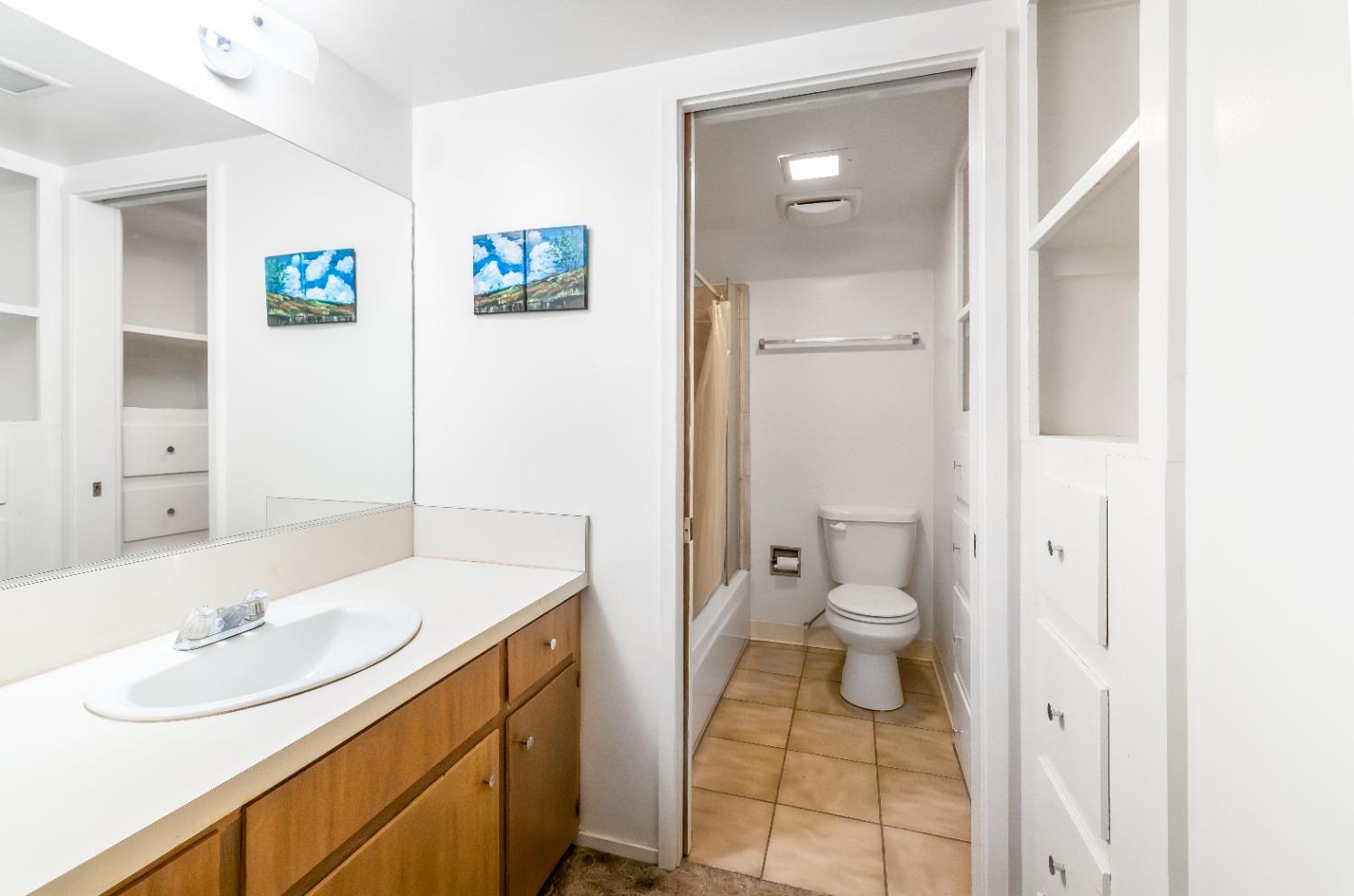 36659 Douglas Ranger Station Road North Fork, CA 93643 - Photo 14 of 38 a bathroom with a sink a toilet and shower