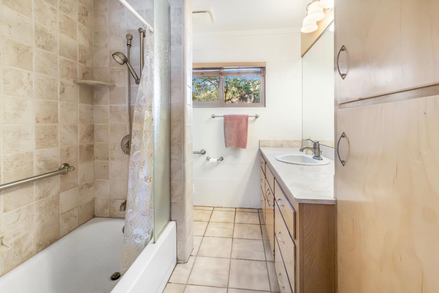 36659 Douglas Ranger Station Road North Fork, CA 93643 - Photo 17 of 38 a bathroom with a sink a toilet and shower