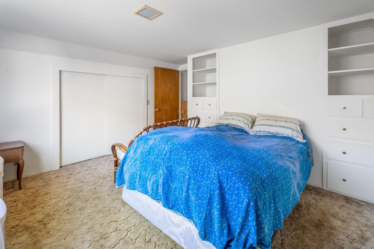 36659 Douglas Ranger Station Road North Fork, CA 93643 - Photo 19 of 38 a bedroom with a bed and closet