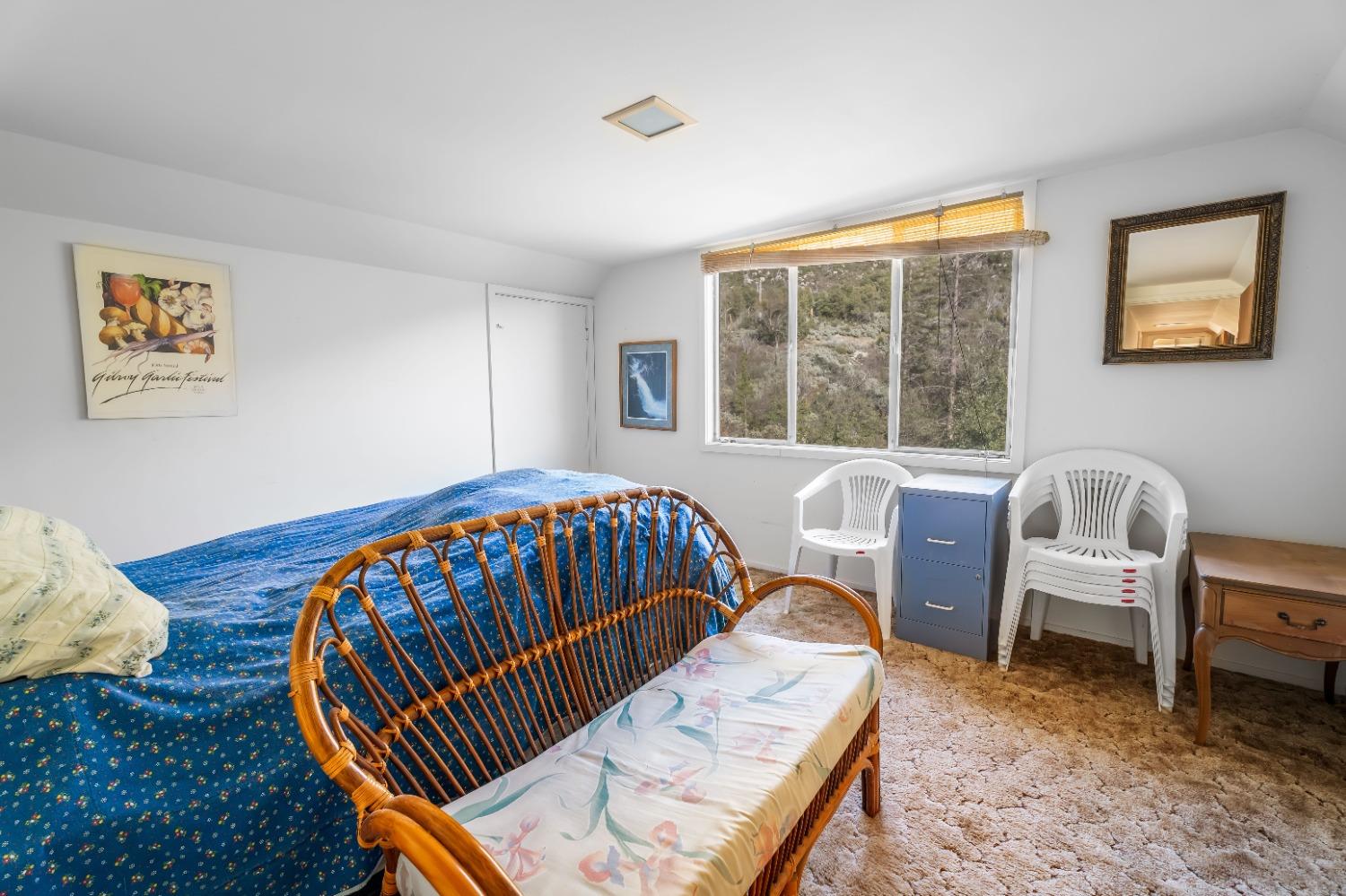 36659 Douglas Ranger Station Road North Fork, CA 93643 - Photo 20 of 38 a bedroom with furniture and a window