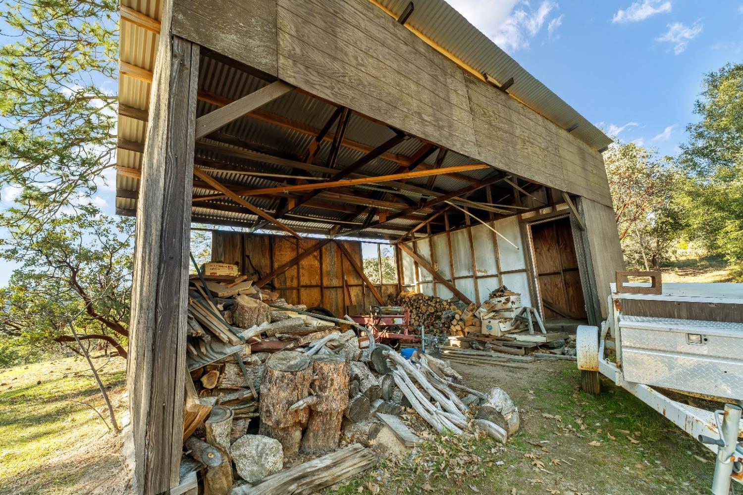 36659 Douglas Ranger Station Road North Fork, CA 93643 - Photo 30 of 38 a view of a house with a yard