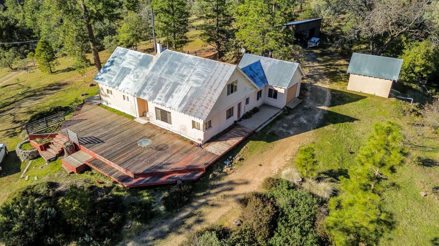 36659 Douglas Ranger Station Road North Fork, CA 93643 - Photo 5 of 38 an aerial view of a house with a yard