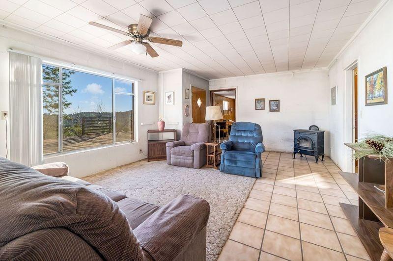 36659 Douglas Ranger Station Road North Fork, CA 93643 - Photo 10 of 38 a living room with furniture and a window