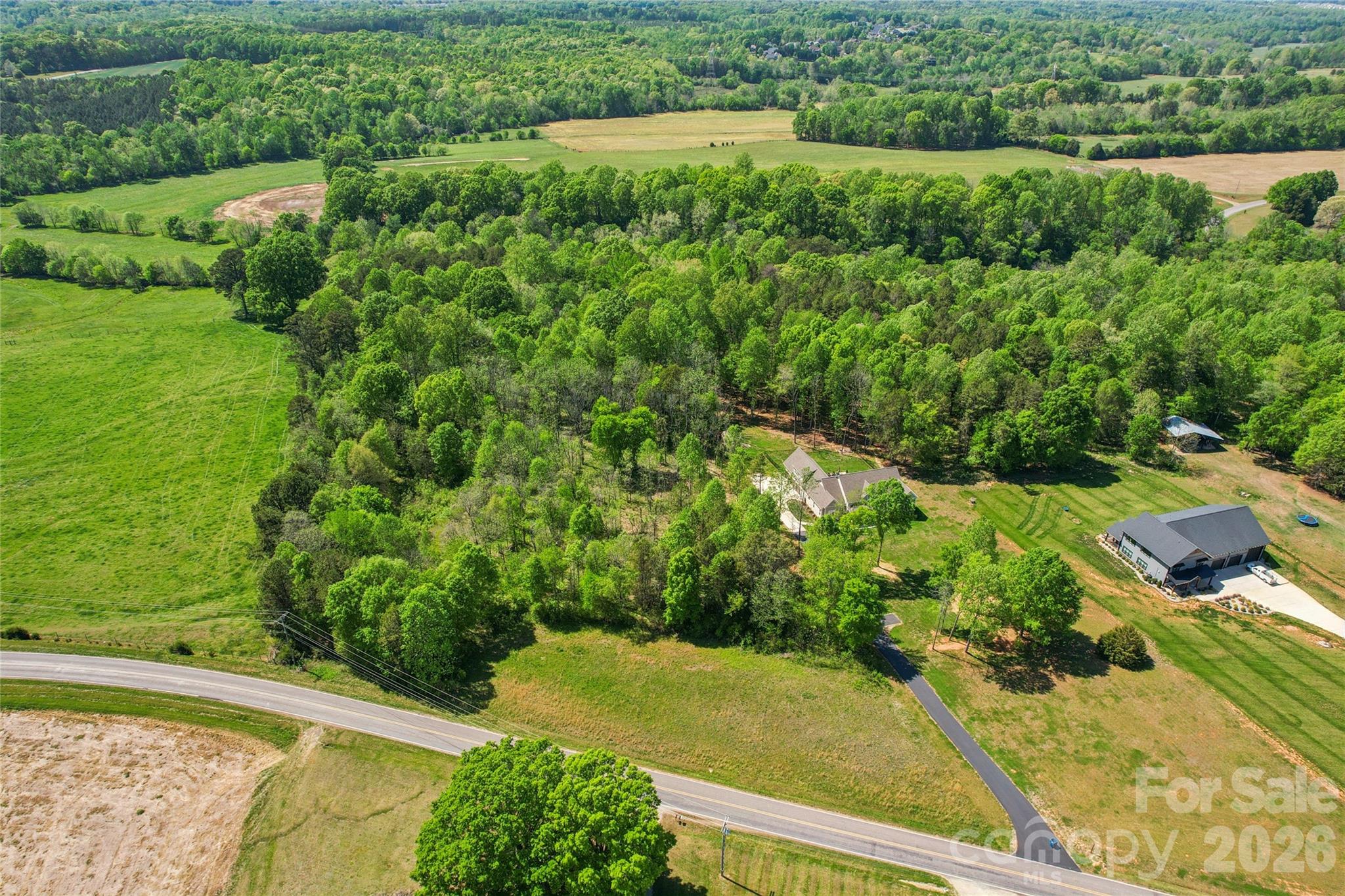 1025 Patterson Farm Road Mooresville, NC 28115 - Photo 6 of 14 a view of a yard with an outdoor seating and lake view