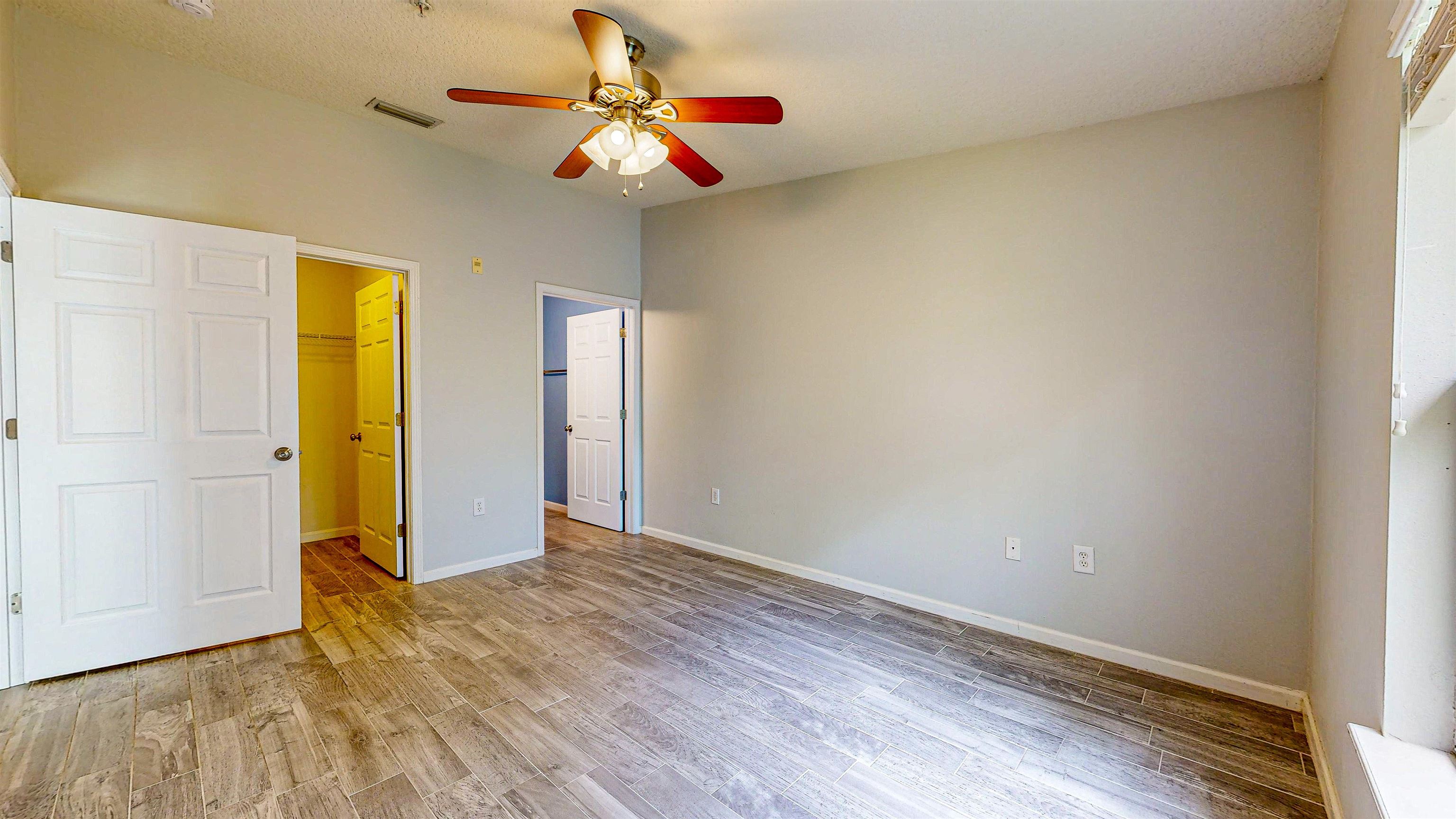 2724 Golden Lake Loop St. Augustine, FL 32084 - Photo 20 of 43 a view of an empty room with window and wooden floor