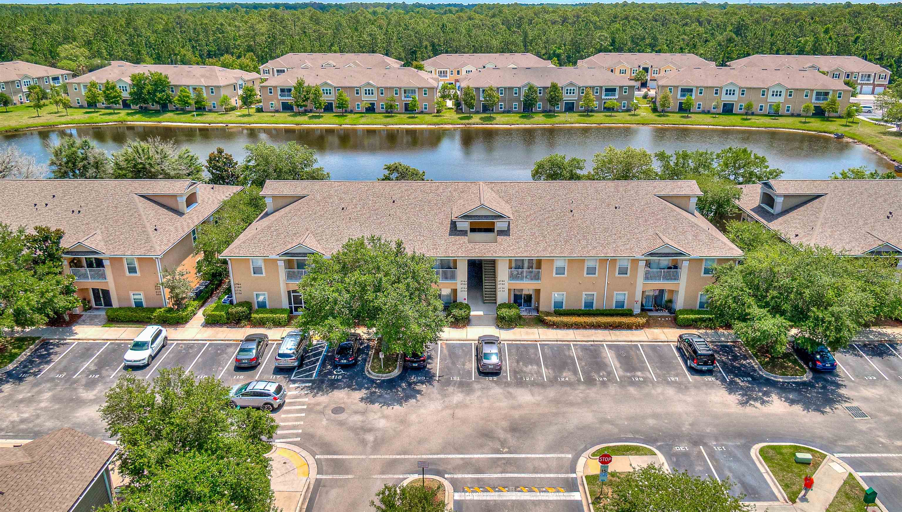 2724 Golden Lake Loop St. Augustine, FL 32084 - Photo 39 of 43 an aerial view of a house with a garden and lake view