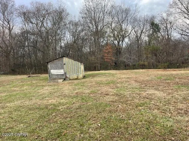 a view of garden with trees