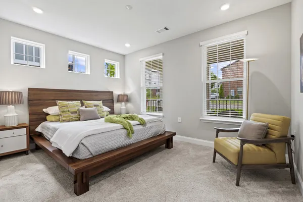 a bedroom with a bed and a couch