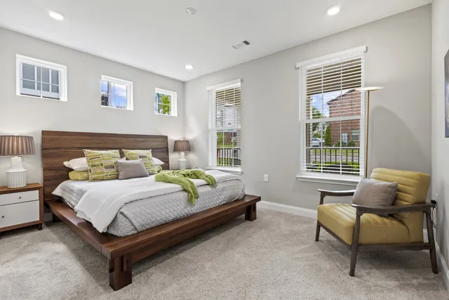 a bedroom with a bed and a couch