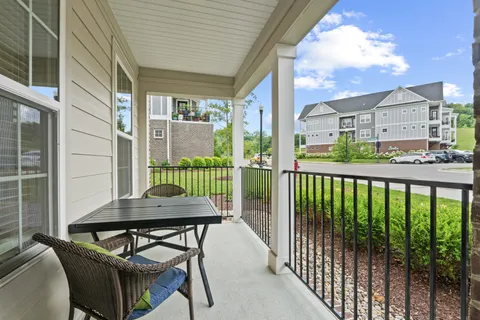 a view of a balcony with furniture