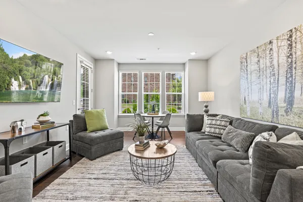 a living room with furniture and a large window