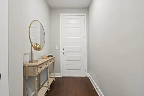 a view of a hallway with washer and dryer
