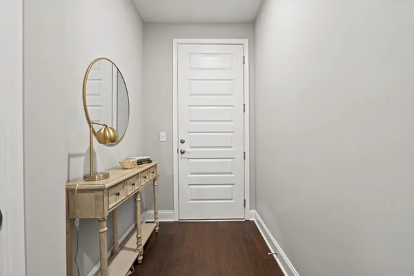 a view of a hallway with washer and dryer