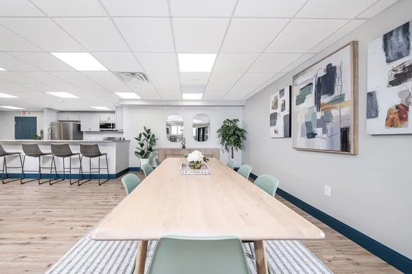 a kitchen with stainless steel appliances granite countertop a refrigerator a stove top oven a sink and dishwasher